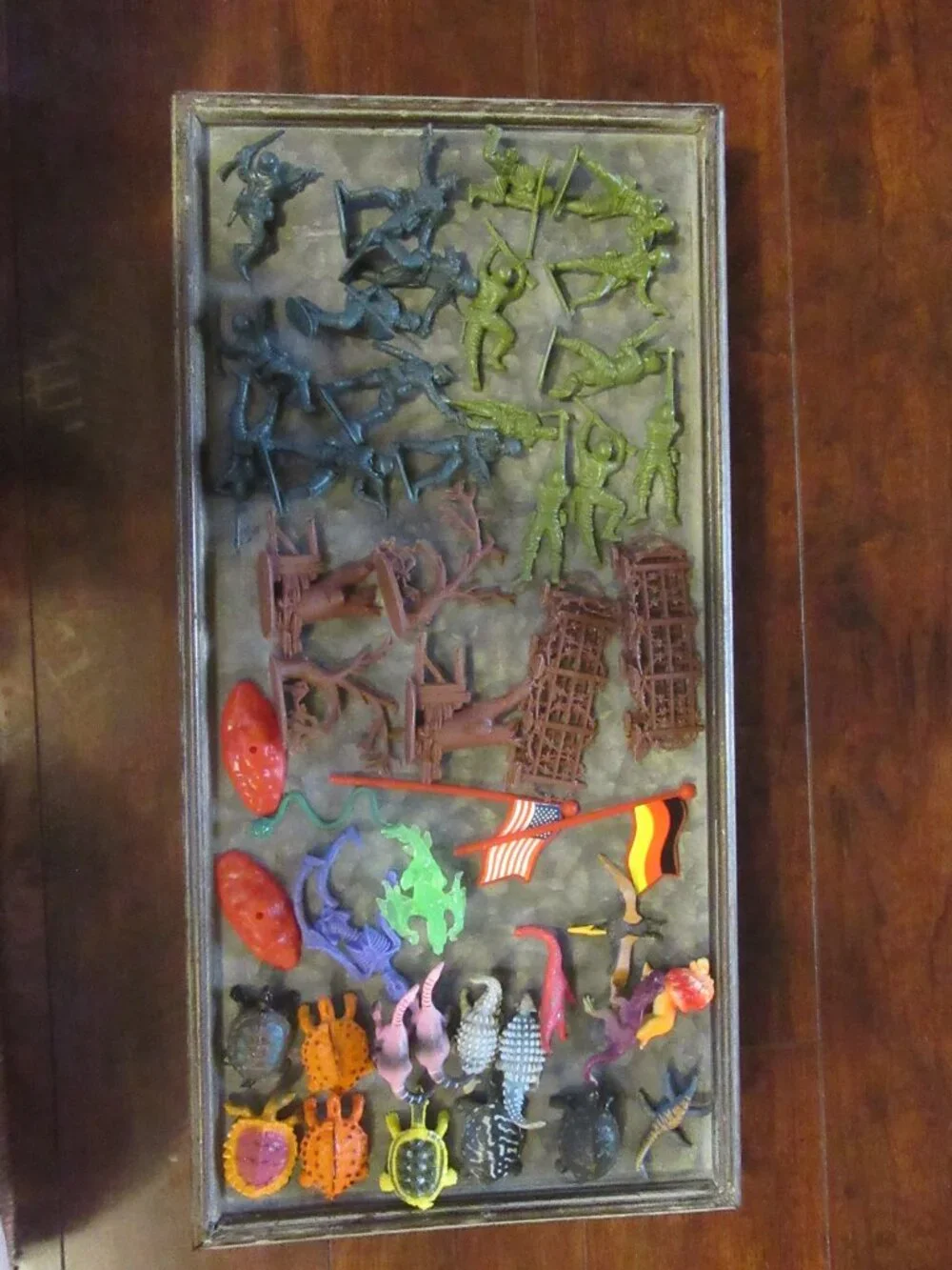 50 small plastic toys; some army men; turtles; flags; fences
